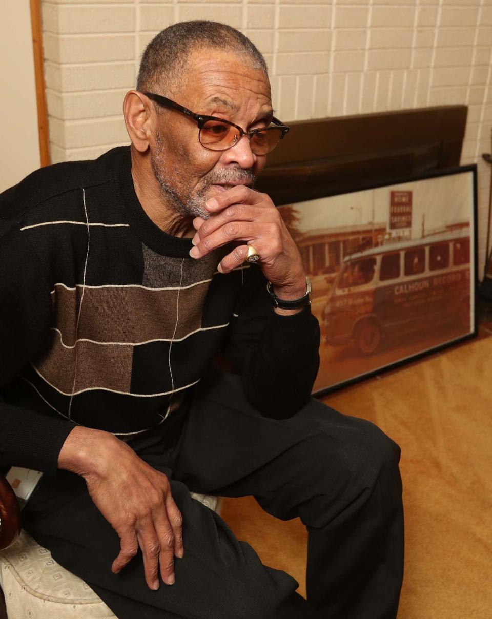 Homell Calhoun Jr. talks about the Calhoun Record Shop, a record store started by his parents, Rebecca and Homell Calhoun Sr. The Wooster Avenue shop was demolished to make way for the Akron Innerbelt. A photo of a van promoting the store is in the background.