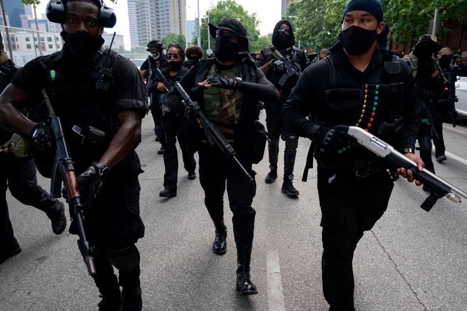 Grandmaster Jay leads members of his militia in a march in Louisville on July 25, 2020.