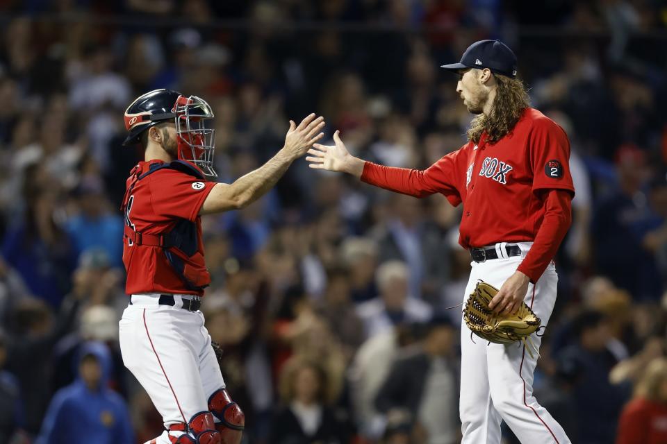 Boston Red Sox's Matt Strahm, right, and Connor Wong celebrate after defeating the Kansas City Royals during the ninth inning of a baseball game, Friday, Sept. 16, 2022, in Boston. (AP Photo/Michael Dwyer)