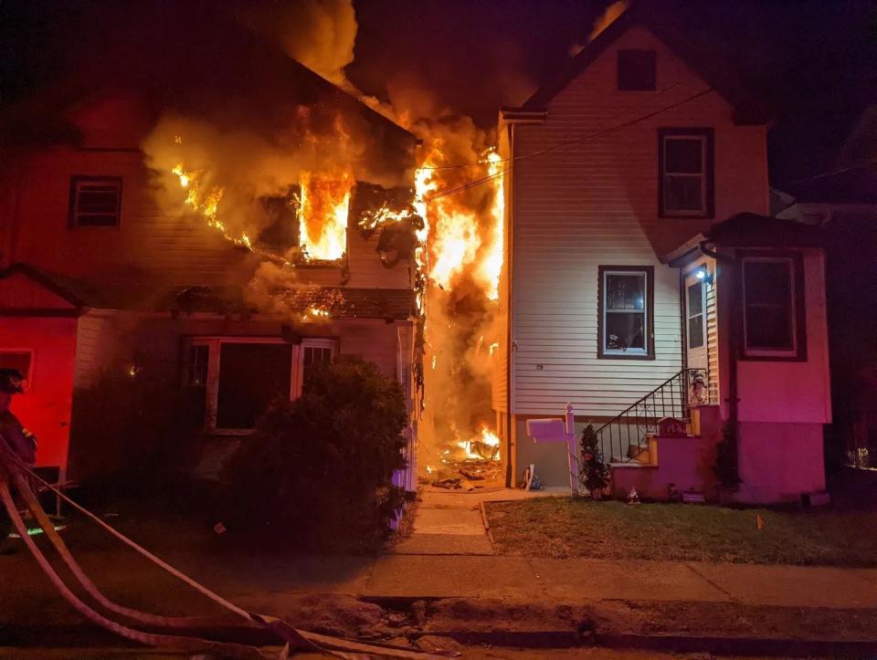 Firefighters battled a three-alarm blaze on Franklin Street in Hackensack that damaged two buildings and sent six people to the hospital with minor injuries on Tuesday, Jan. 18, 2022.