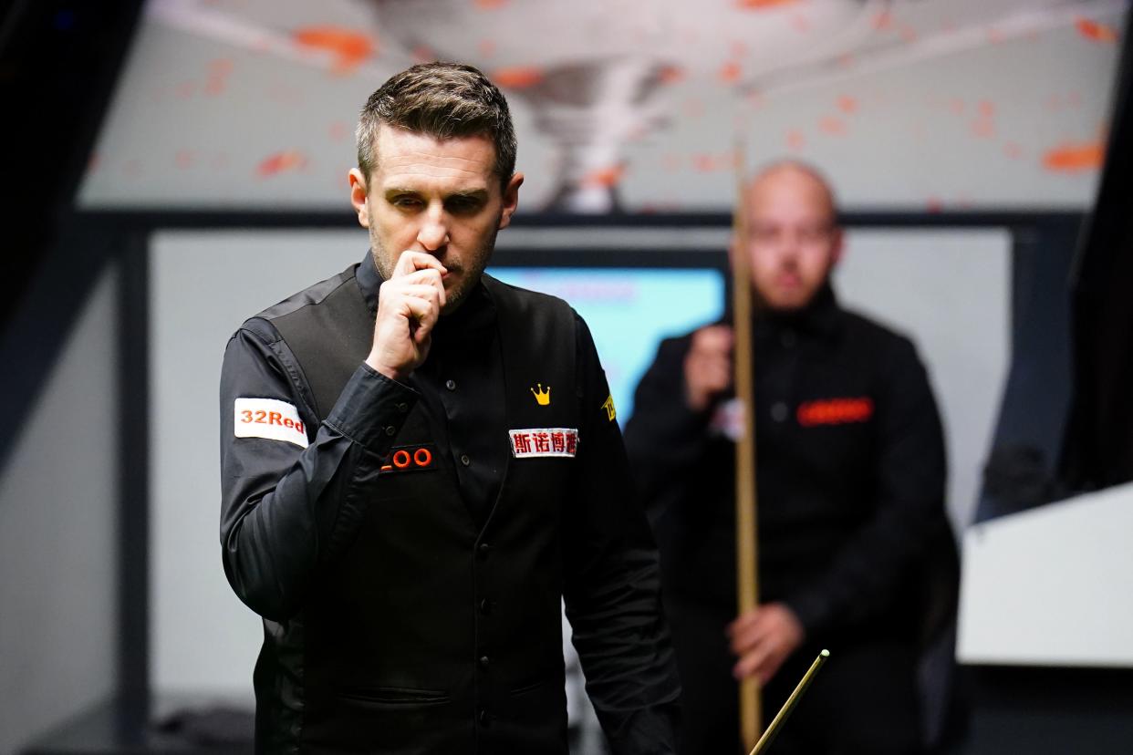 Selby contemplates a shot during the opening session (PA)