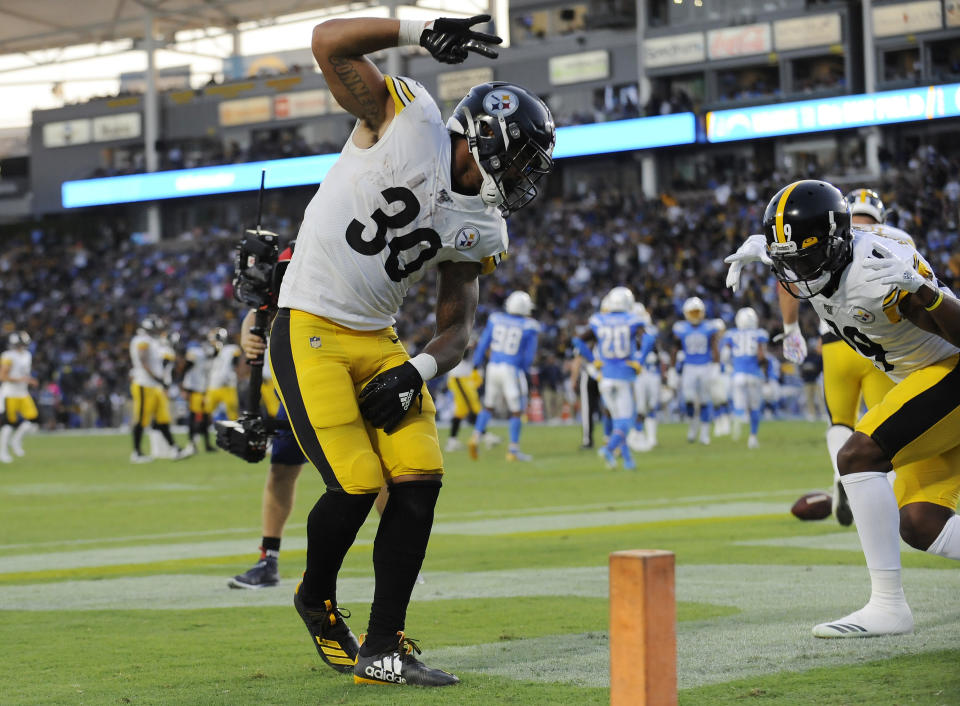 Oct 13, 2019; Carson, CA, USA; Pittsburgh Steelers running back James Conner (30) celebrates with wide receiver JuJu Smith-Schuster (19) his touchdown scored against the Los Angeles Chargers during the first half at Dignity Health Sports Park. Mandatory Credit: Gary A. Vasquez-USA TODAY Sports