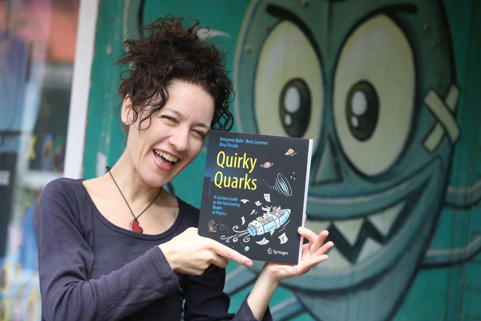 TORONTO, ON - MAY 12: Rina Piccolo, Toronto cartoonist poses with her latest project , Quirky Quarks: A Cartoon Guide to the Fascinating Realm of Physics book at The Beguilling shop. She'll be at the upcoming Toronto Comic Arts Festival.        (Vince Talotta/Toronto Star via Getty Images)