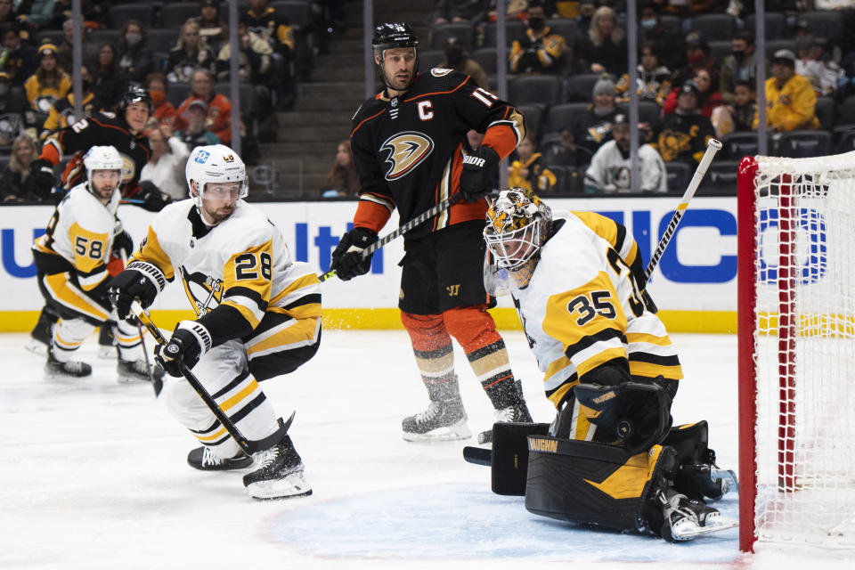 Pittsburgh Penguins goaltender Tristan Jarry (35) stops a shot in the second period of an NHL hockey game against the Anaheim Ducks in Anaheim, Calif., Tuesday, Jan. 11, 2022. (AP Photo/Kyusung Gong)