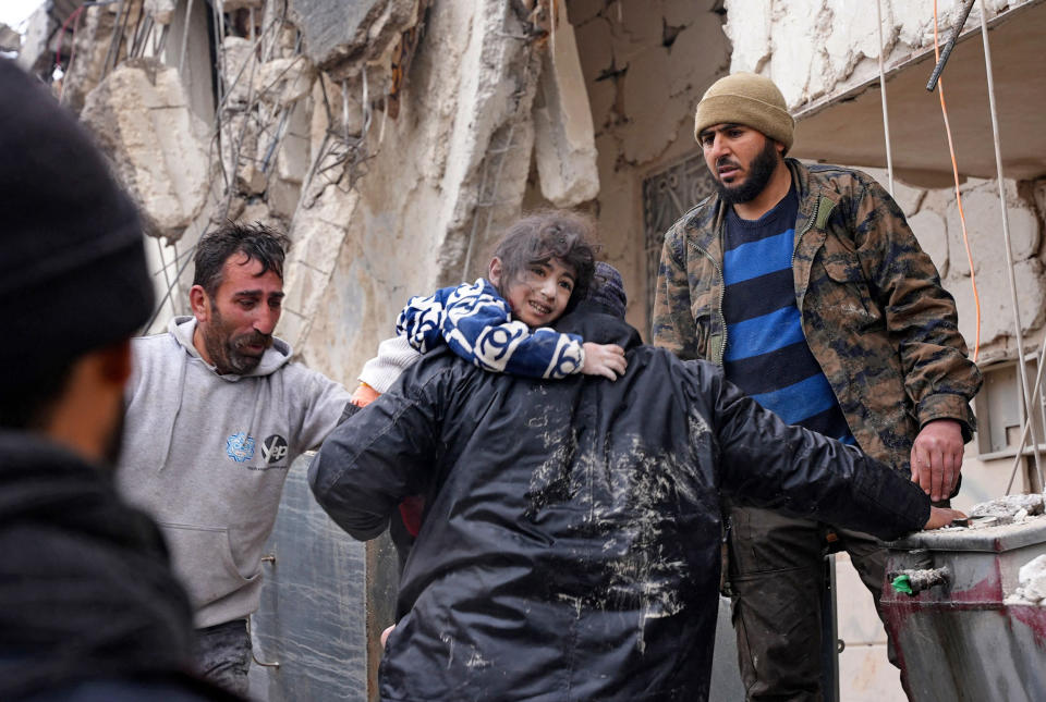 Residents retrieve a child from the rubble in Jandaris in a rebel-held area of Syria's Aleppo province. (Rami Al Sayed / AFP - Getty Images)