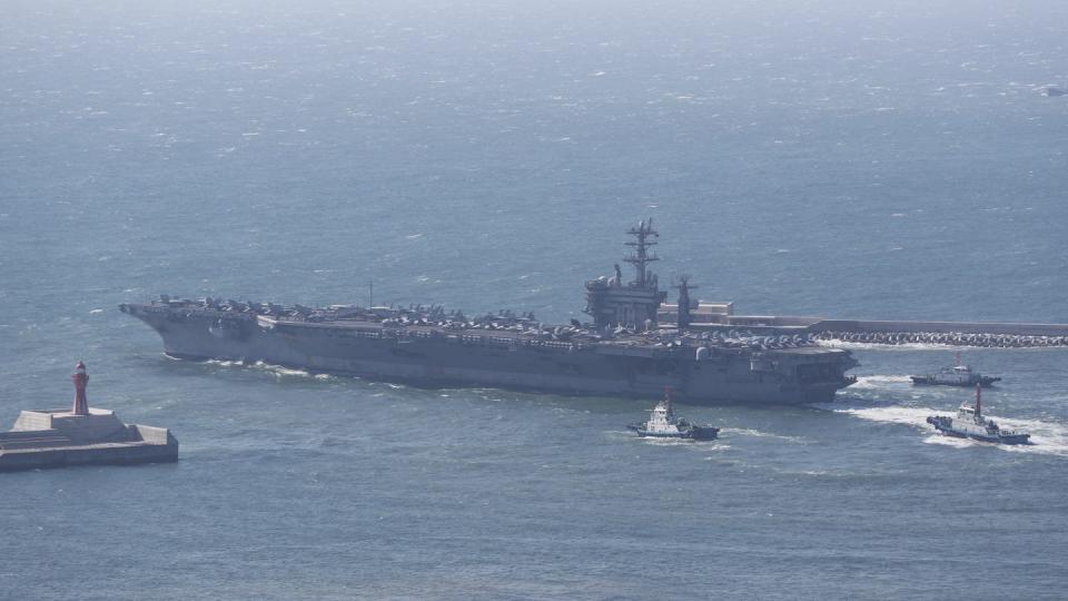 The aircraft carrier Nimitz departs a naval base in Busan, South Korea, on April 2. (Cha Geun-ho/Yonhap via AP)