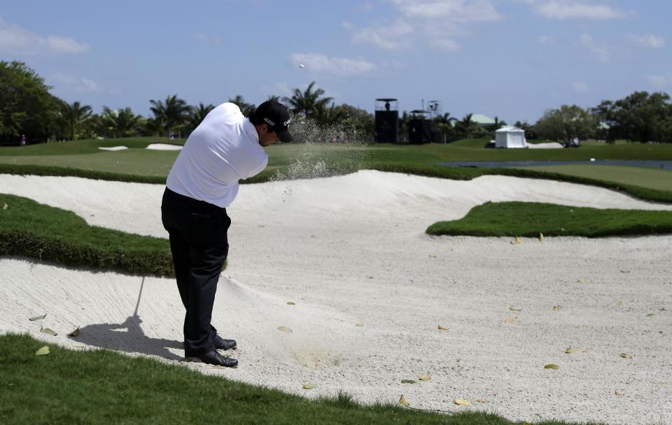 Patrick Reed hits from a third hole sand trap during the second round of the Cadillac Championship golf tournament on Friday, March 7, 2014, in Doral, Fla. (AP Photo/Lynne Sladky)