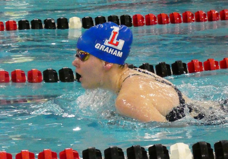 Lakewood senior Emma Graham swims the breaststroke in the 200 individual medley during a meet against Newark, Central Crossing and West Muskingum at the Licking County Family YMCA on Friday, Jan. 14, 2022.