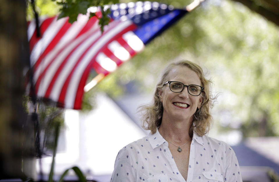 In this July 27, 2017 photo, Master Sgt. Erika Stoltz, poses for a photo at her home in Sun Prairie, Wis. Stoltz, 56, served four combat deployments and earned two Bronze Stars. After returning from Afghanistan, she transitioned from male to female while working full-time for the Army. (M.P. King/Wisconsin State Journal via AP)