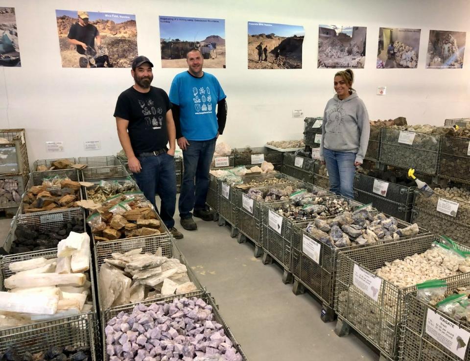 Rough Stone Rocks employees in Merrimack, New Hampshire, from left, are Donny Divers, Chris Fiske and Dani Duffy. They stand among bins filled with bulk crystals, minerals and rocks sourced from all over the world.