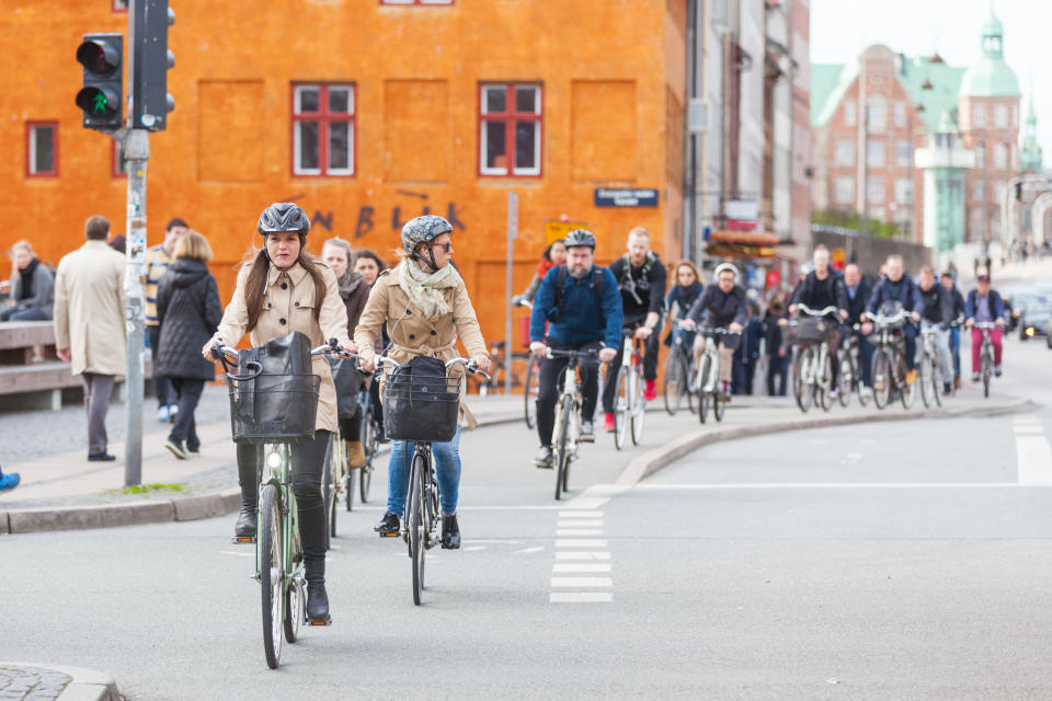 People commuting by bike in Copenhagen, Denmark. Some cities are already well set up for cleaner transportation options such as cycling. (Photo: william87 via Getty Images)