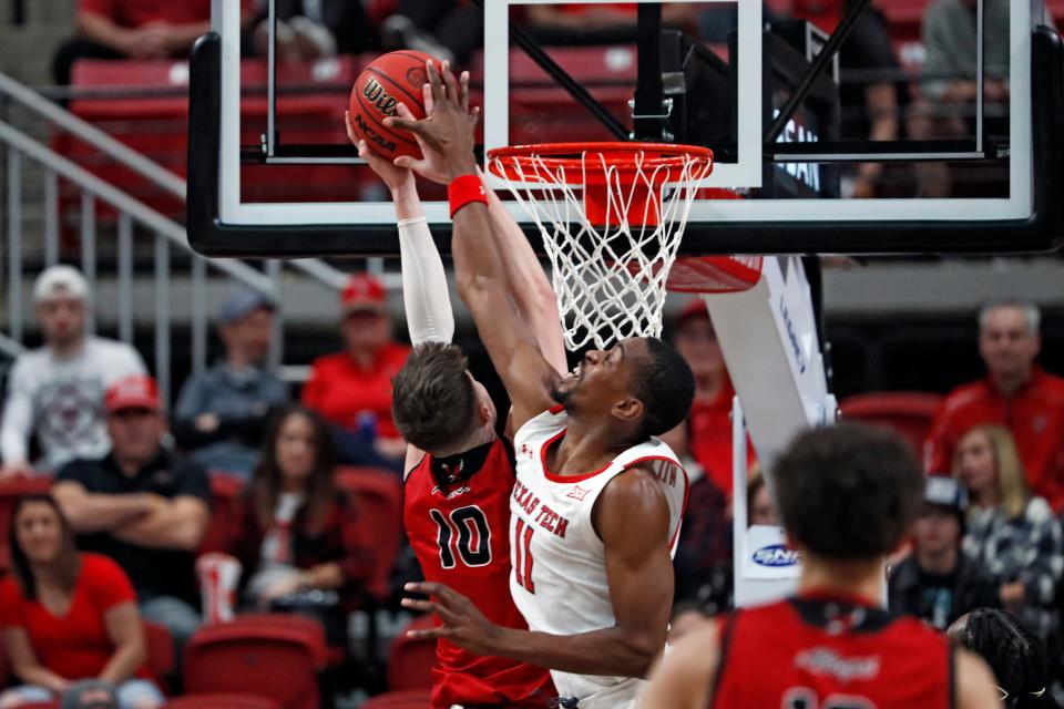 Texas Tech's Bryson Williams (11) blocks the shot by Eastern Washington's Ethan Price (10) during the first half of a nonconference game against Eastern Washington on Wednesday at United Supermarkets Arena.