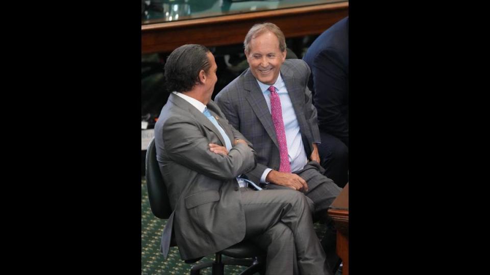 Attorney General Ken Paxton, middle, waits with his attorneys Tony Buzbee, left, and Mitch Little for closing arguments to begin at his impeachment trial at the Capitol on Friday September 15, 2023.