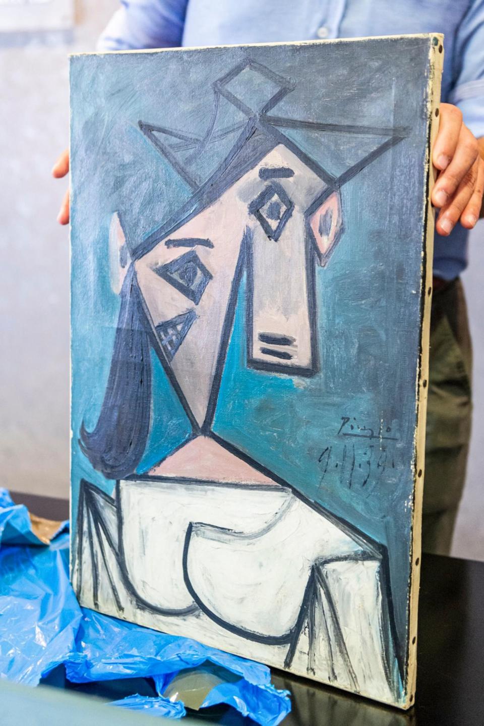 This handout photograph taken and released by the Greek Police on June 29, 2021 shows a recovered painting of Picasso titled 