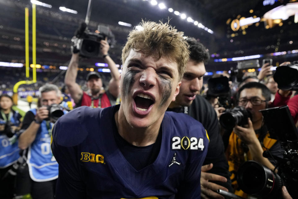 Michigan quarterback J.J. McCarthy celebrates after their win in the national championship NCAA College Football Playoff game against Washington Monday, Jan. 8, 2024, in Houston. (AP Photo/David J. Phillip)