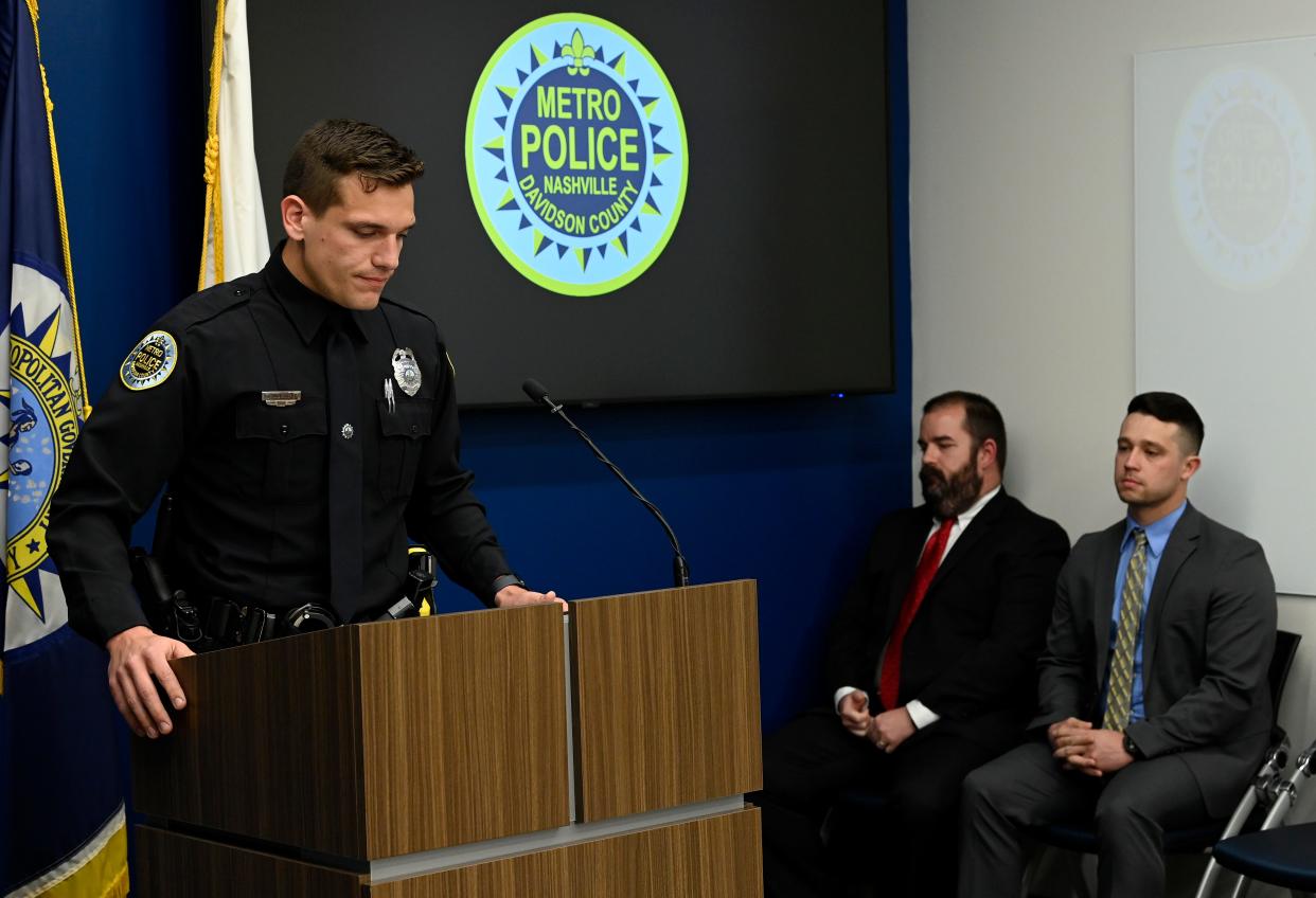 Metro Nashville Police Officer Rex Engelbert speaks about his role he had in responding to the mass shooting at Covenant School as Metro Nashville Police Detective Sgt. Jeff Mathes, sitting left, Detective Michael Collazo listen during a press conference Tuesday,  April 4, 2023, 2023, in Nashville, Tenn.