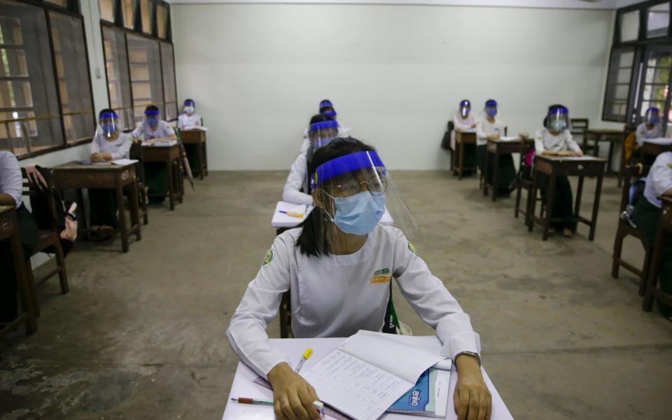 High school students wearing PPE attend class at a school in Yangon, Myanmar - LYNN BO BO/EPA-EFE/Shutterstock 