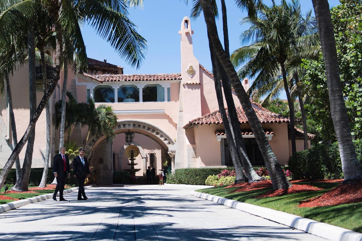 Donald Trump and Chinese President Xi Jinping walk together at the Mar-a-Lago estate in West Palm Beach, Florida: JIM WATSON/AFP/Getty Images