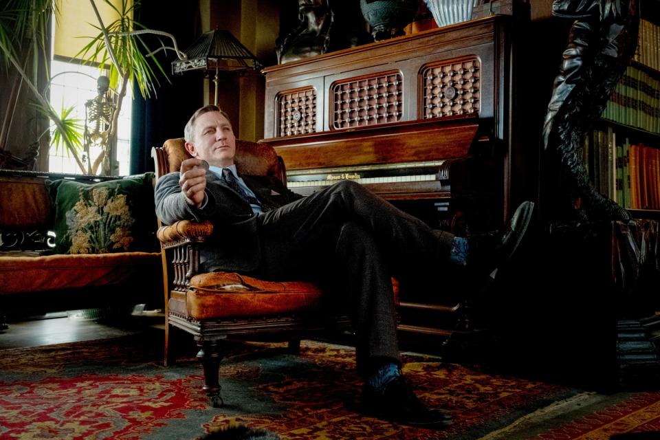 Daniel Craig sits in a comfy looking chair