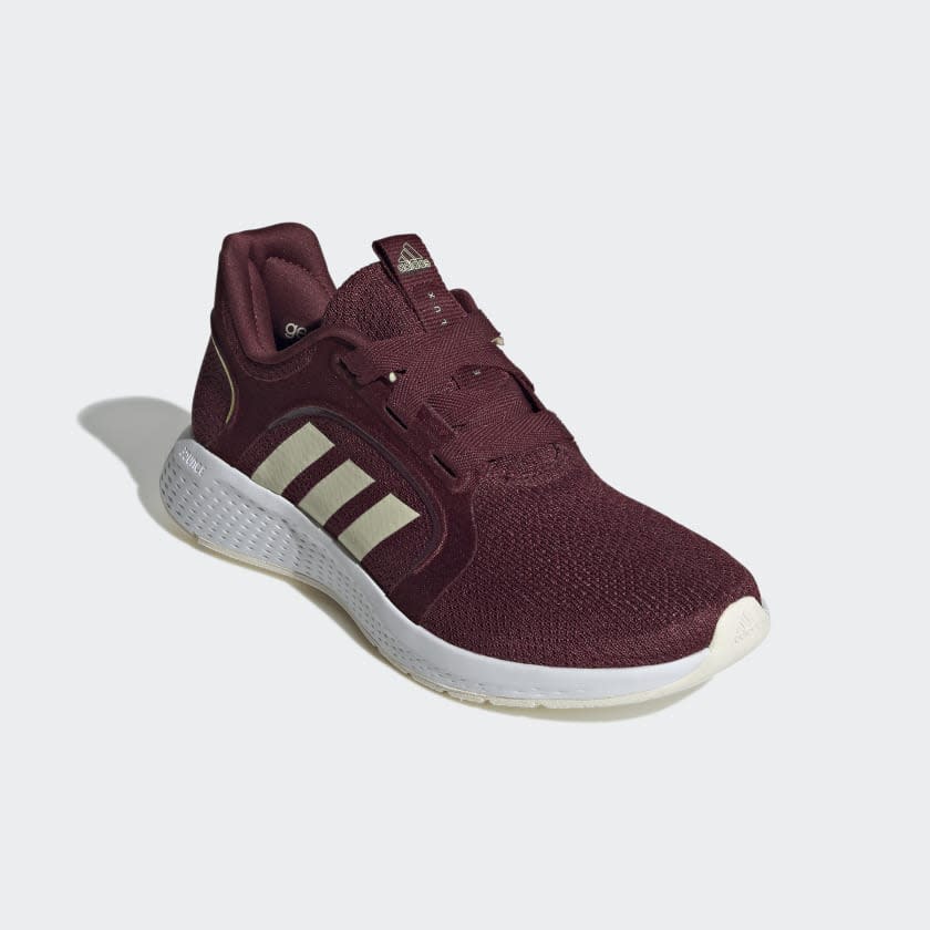 Burgundy shoes with three cream stripes.