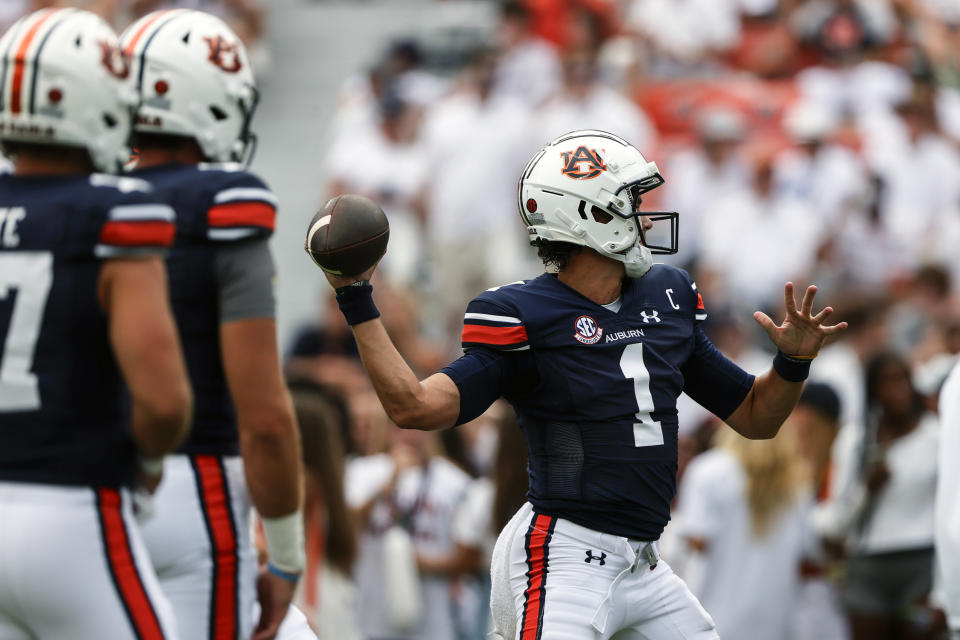 Auburn quarterback Payton Thorne (1) warms up before an NCAA college football game against Massachusetts Saturday, Sept. 2, 2023, in Auburn, Ala. (AP Photo/Butch Dill)