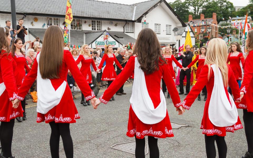 Irish female folk dancers during the celebrations - Howard Pimborough / Alamy Stock Photo