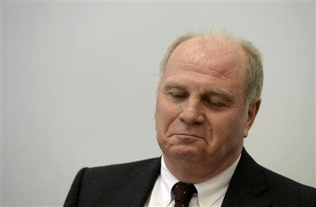 Bayern Munich President Uli Hoeness arrives for the verdict in his trial for tax evasion at the regional court in Munich March 13, 2014. A German court convicted Hoeness of tax evasion on Thursday and sentenced the soccer manager who turned Bayern Munich into one of the world's most successful clubs to three years and six months in jail. REUTERS/Christof Stache/Pool