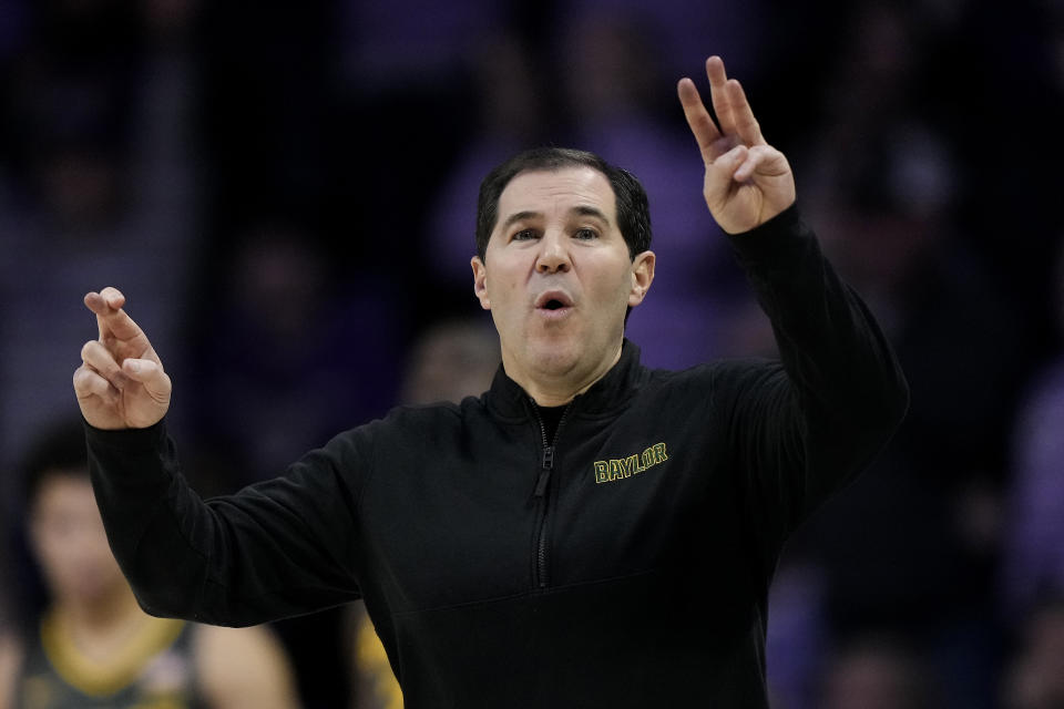 Baylor head coach Scott Drew talks to his players during the first half of an NCAA college basketball game against Kansas State Tuesday, Jan. 16, 2024, in Manhattan, Kan. (AP Photo/Charlie Riedel)