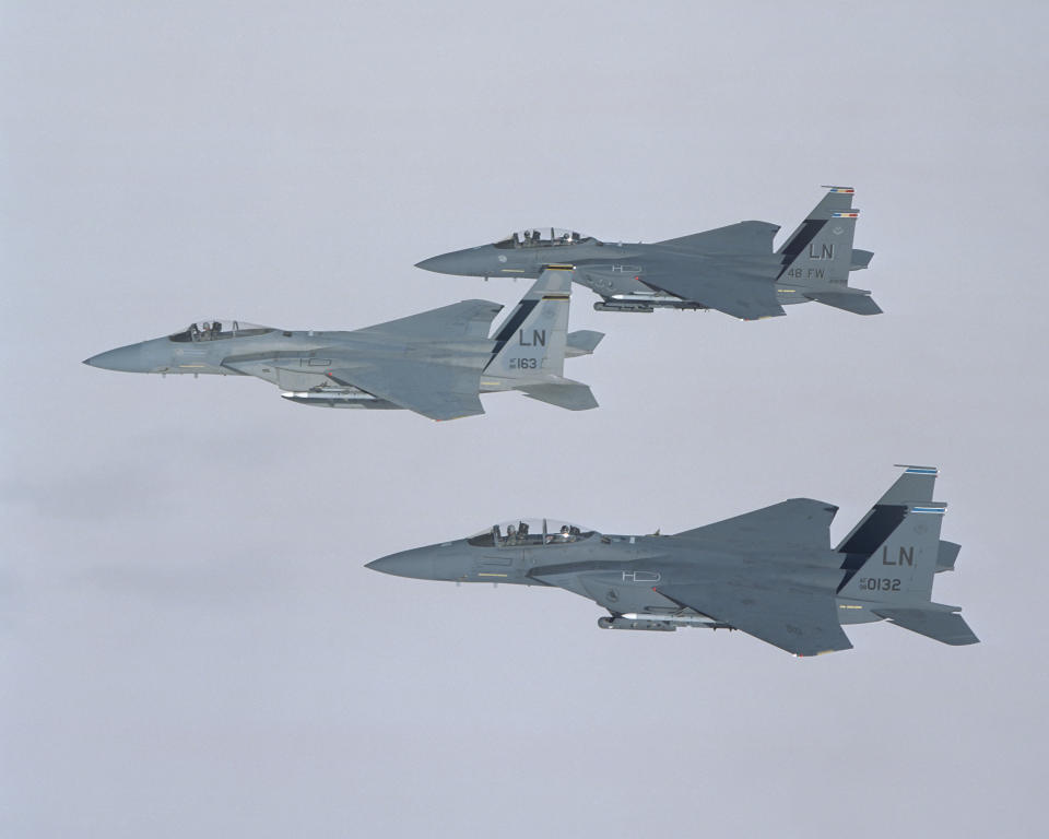 Three Boeing F-15s in flight.