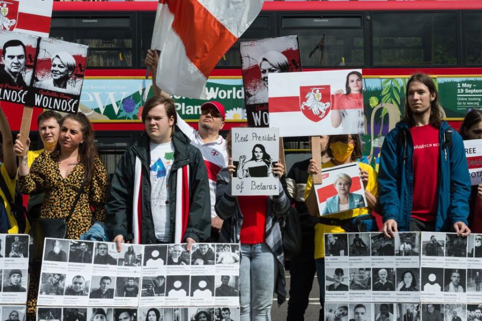 Belarusian activists and their supporters from neighboring countries protest in Parliament Square against the regime of Alexander Lukashenko and his brutal crackdown on the opposition, journalists, and activists on the first anniversary of the fraudulent presidential elections in London, United Kingdom, on Aug. 8, 2021. (Wiktor Szymanowicz/Anadolu Agency via Getty Images)