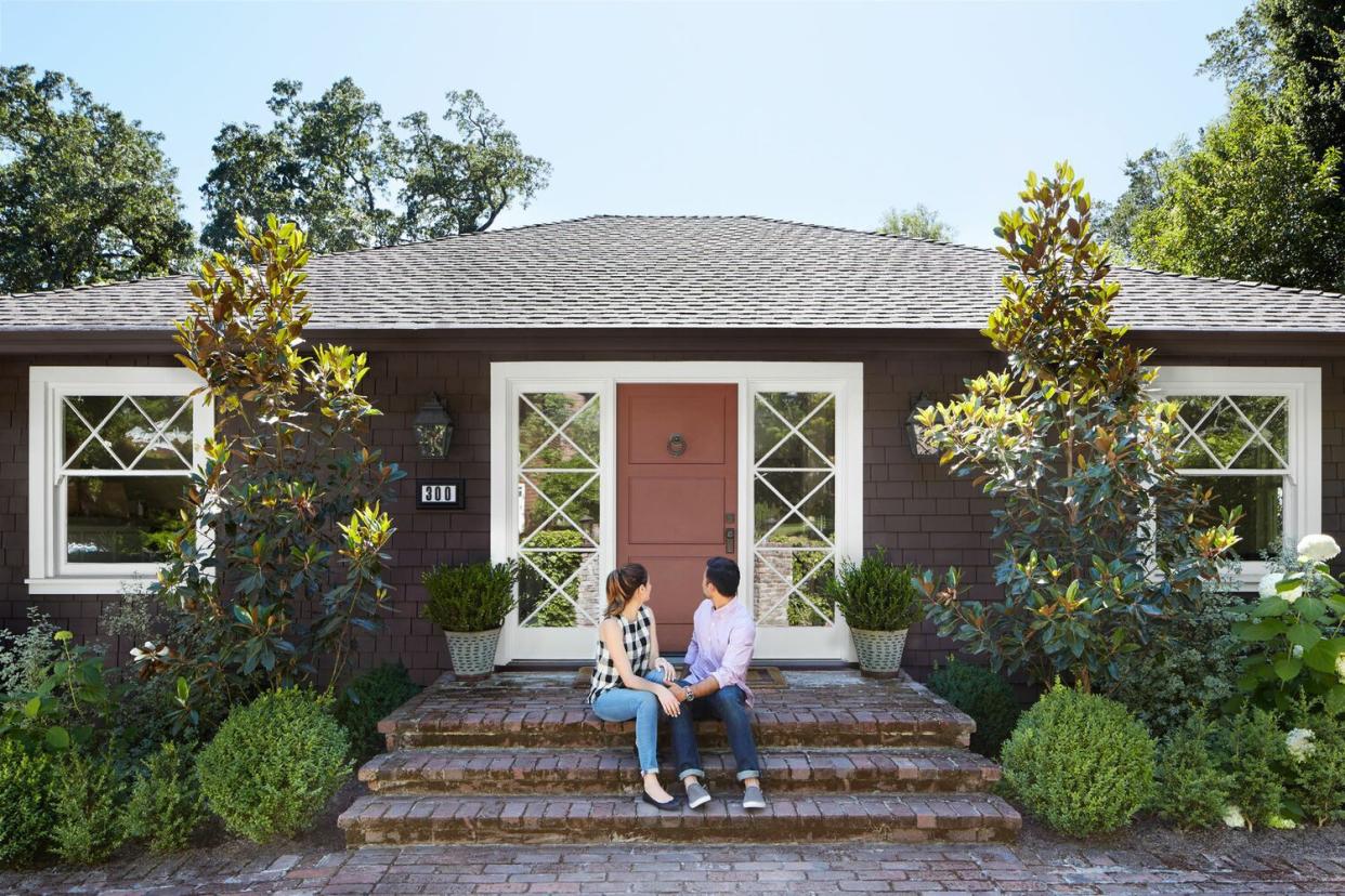 couple on front house steps