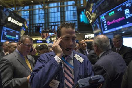 Trader Greg Rowe works on the floor of the New York Stock Exchange, October 2, 2013. REUTERS/Brendan McDermid