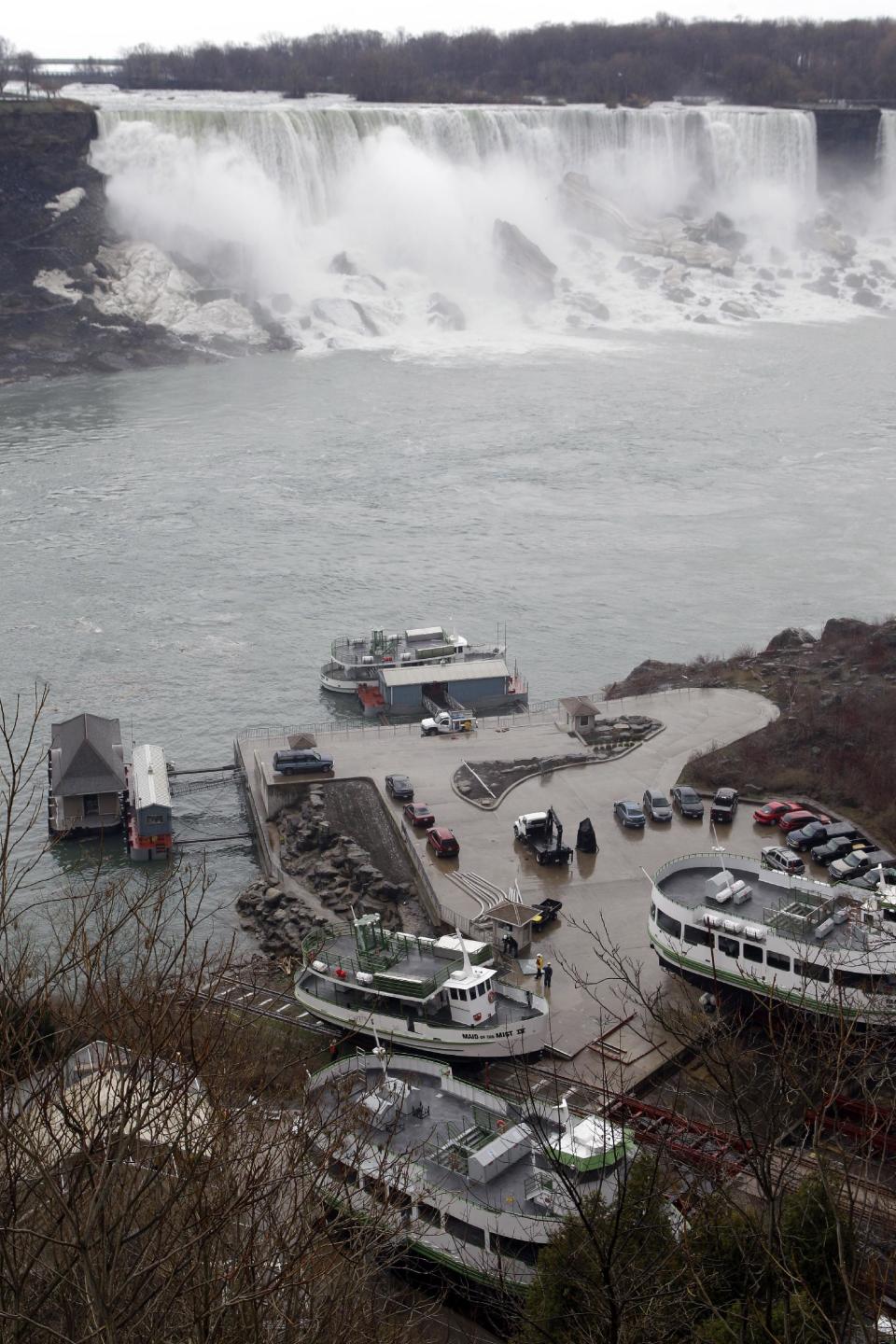 FILE - In this April 27, 2011 file photo, workers launch The Maid of the Mist tour boat in preparation for the upcoming tourist season in Niagara Falls, Ontario. The tour company chosen to take over the Niagara Falls tour boat business in Canada says it plans to build customized new boats and upgrade amenities while maintaining the things that have made the sightseeing rides so popular for more than 100 years. (AP Photo/David Duprey, File)