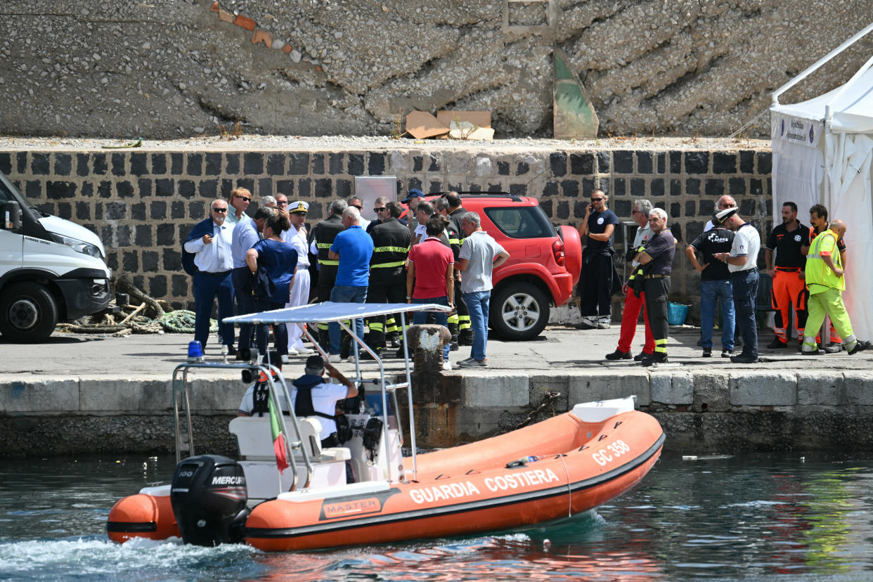 Italian rescue team works in Porticello near Palermo, on August 20, 2024 a day after the British-flagged luxury yacht Bayesian sank. Specialist divers launched a fresh search for six people, including UK tech tycoon Mike Lynch and the chairman of Morgan Stanley International, missing since their yacht capsized off the Italian island of Sicily. The Bayesian, which had 22 people aboard including 10 crew, was anchored some 700 metres from port before dawn when it was struck by a waterspout, a sort of mini tornado. Fifteen people aboard, including a mother with a one-year-old baby, were plucked to safety; one man has been found dead; and six people remain missing. (Photo by Alberto PIZZOLI / AFP) (Photo by ALBERTO PIZZOLI/AFP via Getty Images)