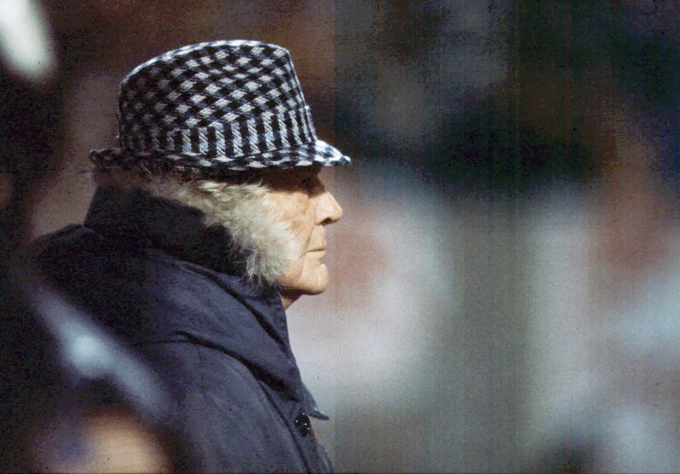 "Bear" Bryant stands on the sidelines at the Liberty Bowl.