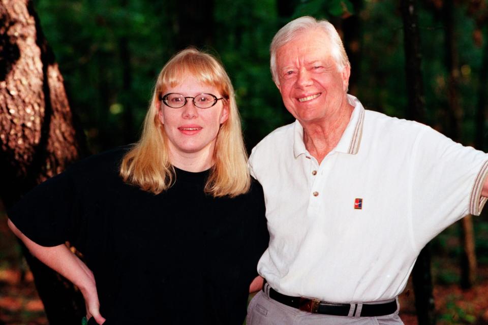 Plains - August 21: President Carter and Amy Carter photo shoot for their new children's book, "The Little Baby Snoogle-Fleejer," in Plains Georgia on August 21, 1995 (Photo By Rick Diamond/Getty Images)