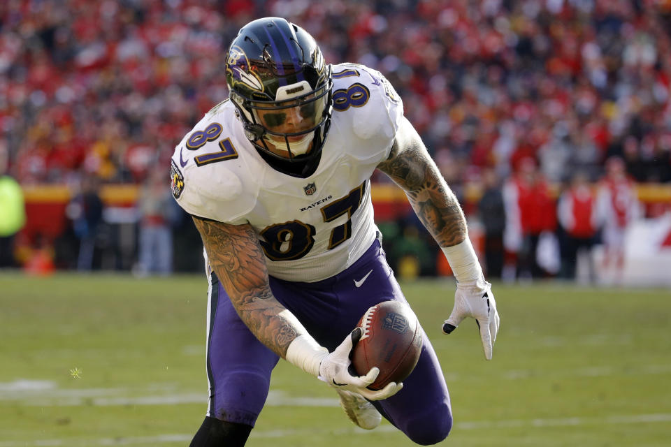 Baltimore Ravens tight end Maxx Williams (87) scores a touchdown during the second half of an NFL football game against the Kansas City Chiefs in Kansas City, Mo., Sunday, Dec. 9, 2018. (AP Photo/Charlie Riedel)