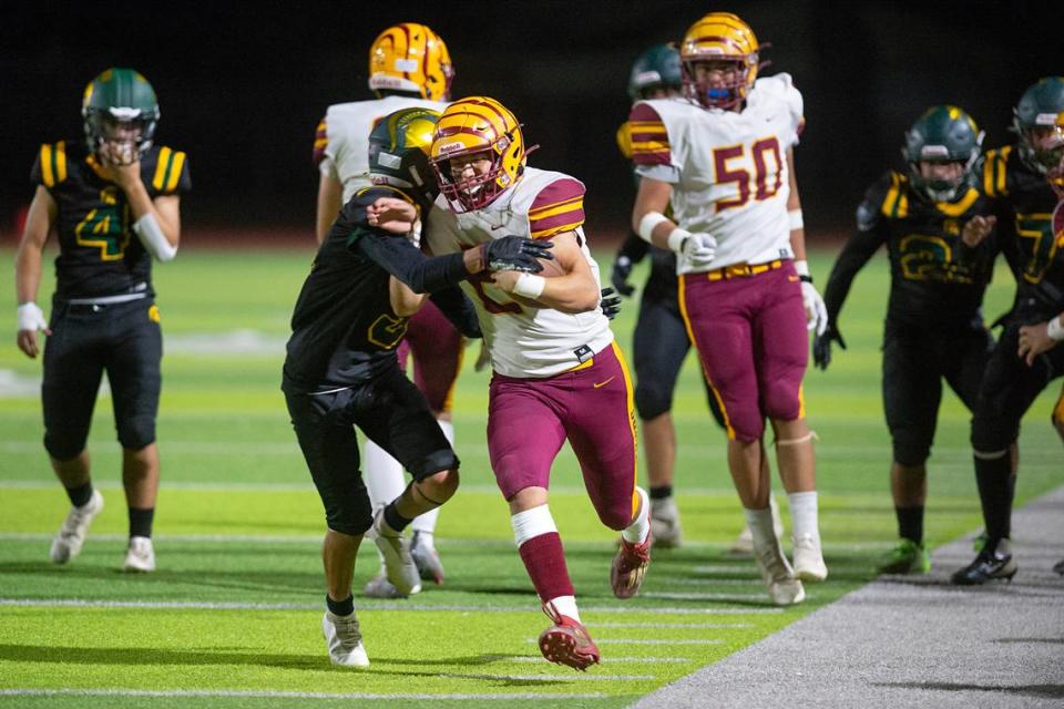 Davis’ Izrael Sanchez forces Los Banos quarterback David Herrera out of bounds during a Western Athletic Conference game at Downey High School in Modesto, Calif., on Friday, September 23, 2022. Andy Alfaro/aalfaro@modbee.com
