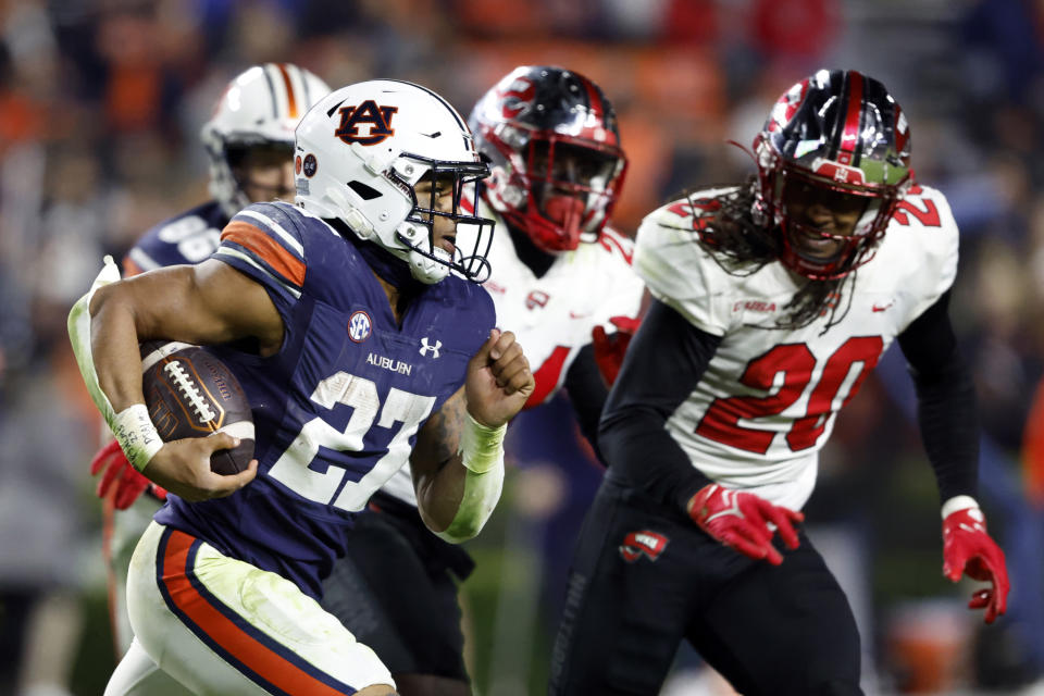 Auburn running back Jarquez Hunter (27) carries the ball against Western Kentucky during the second half of an NCAA college football game, Saturday, Nov. 19, 2022, in Auburn, Ala. (AP Photo/Butch Dill)