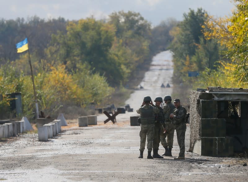 FILE PHOTO: Members of Ukrainian armed forces are seen at a check point in the town of Zolote in Luhansk Region, Ukraine