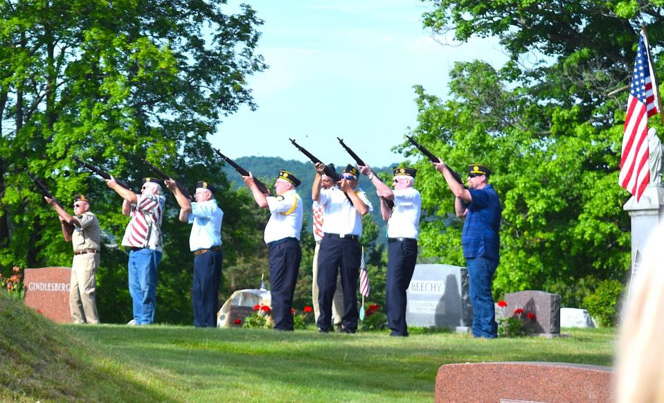 The honor guard offers a three-volley tribute at the Memorial Day ceremony Monday at Oak Hill Cemetery.