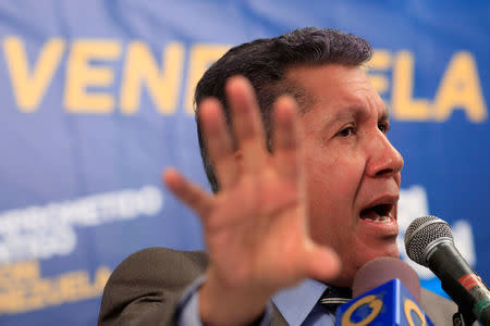 Venezuelan presidential candidate Henri Falcon talks to the media during a news conference in Caracas, Venezuela March 16, 2018. REUTERS/Marco Bello