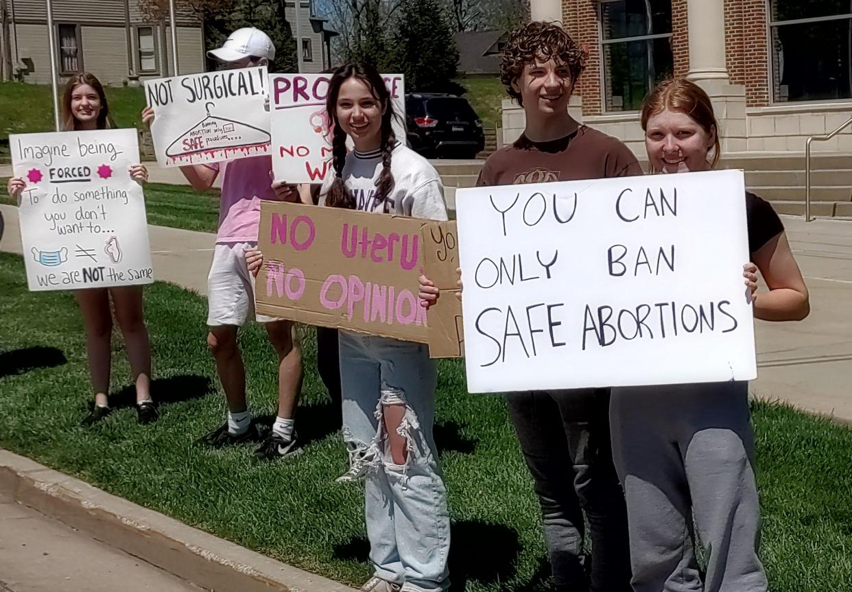 Theodore Roosevelt High School students and community members rallied for reproductive rights on the steps of the Portage County Municipal Court building in Kent on Sunday.