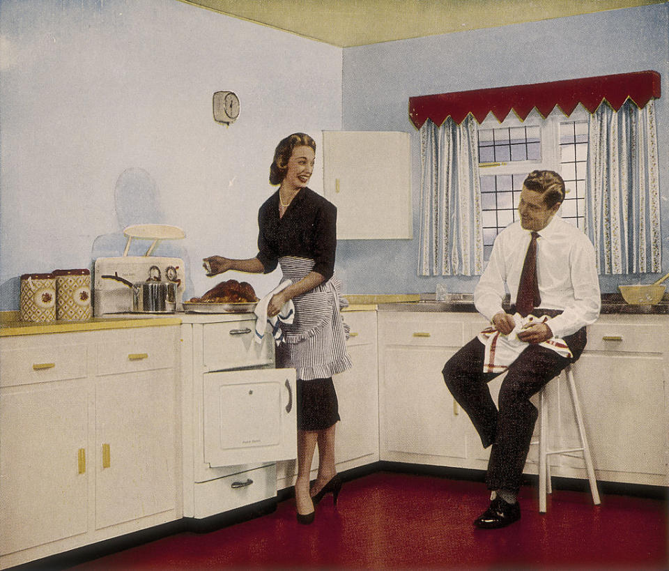 'Who couldn't cook well in a kitchen like this', 1950s. A couple happily preparing a roast. An advertisement for the paint company Robbialac. (Photo by Museum of London/Heritage Images/Getty Images)