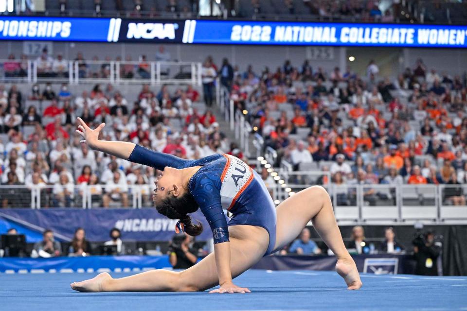 Lee competes on the floor exercise in front of a stadium full of fans at the 2022 NCAA Championships.