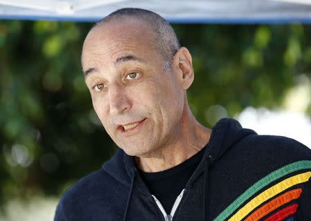 Hollywood mogul and co-creator of The Simpsons, Sam Simon, talks while visiting a chinchilla farm after he financed the purchase of the facility by PETA (People for the Ethical Treatment of Animals) in order to rescue over 400 chinchillas and shutter the business in Vista, California August 19, 2014. REUTERS/Mike Blake