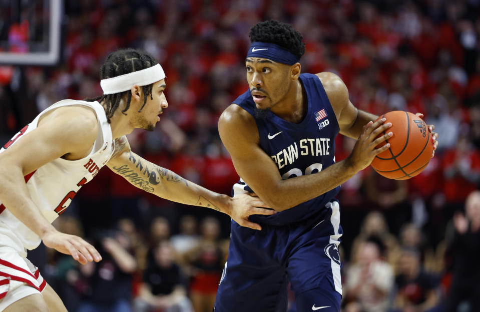 Penn State guard Jalen Pickett (22) drives to the basket against Rutgers guard Caleb McConnell (22) during the first half of an NCAA college basketball game in Piscataway, N.J. Tuesday, Jan. 24, 2023. (AP Photo/Noah K. Murray)