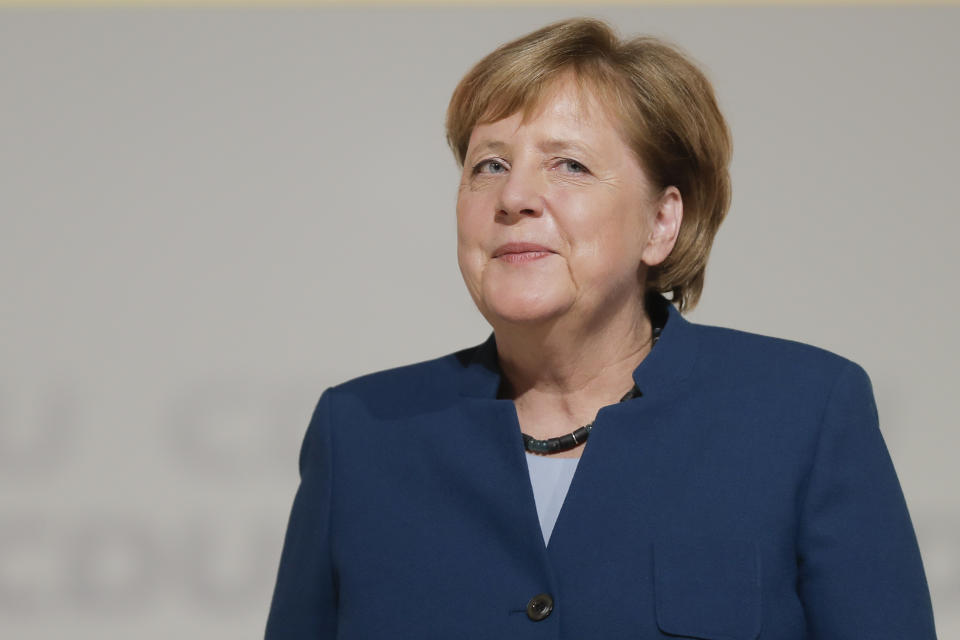 Christian Democratic Union, CDU, chairwoman and German Chancellor Angela Merkel receives the applause after her speech during a party convention of the Christian Democratic Party CDU in Hamburg, Germany, Friday, Dec. 7, 2018. 1001 delegates are electing a successor of German Chancellor Angela Merkel who doesn't run for party chairmanship after more than 18 years at the helm of the party. (AP Photo/Markus Schreiber)