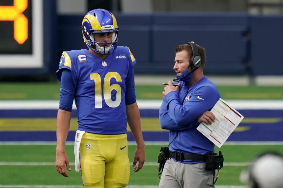 Rams head coach Sean McVay talks to quarterback Jared Goff during a game in 2020.