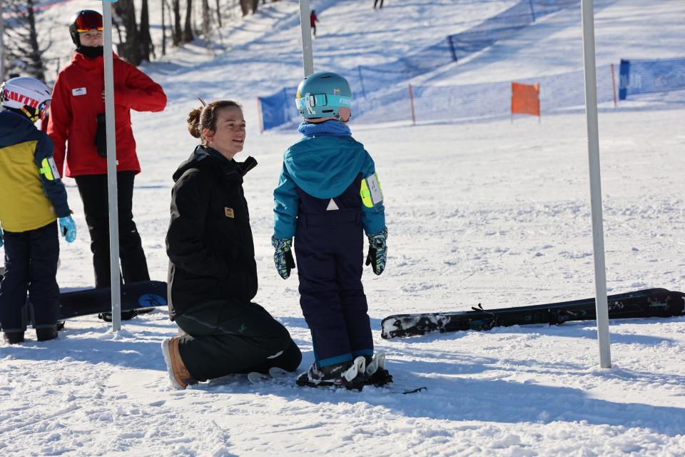 Wachusett snowsports director Courtney Crowley offers words of encouragment to a youngster.